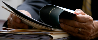 Man Holding Report He's Reading